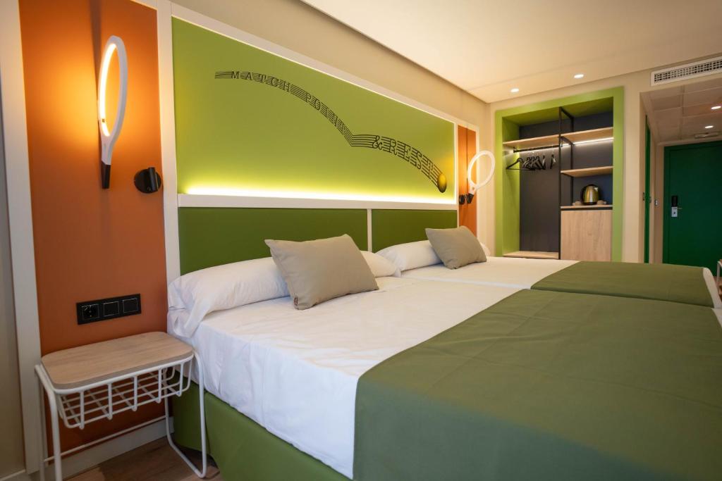 Postel nebo postele na pokoji v ubytování Hotel Magic Sports 4