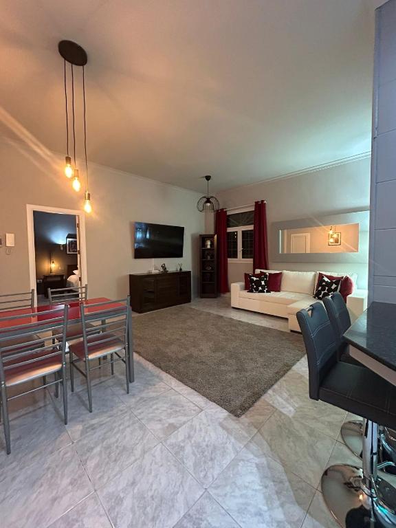 a large living room with a couch and a table at Basement apartments in San Bartolomé