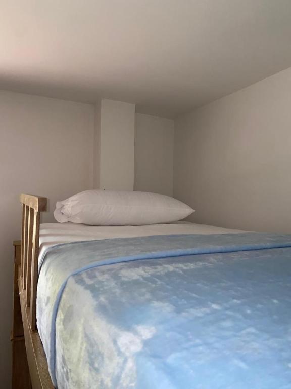 Postel nebo postele na pokoji v ubytování Hostal Aventura Tayrona