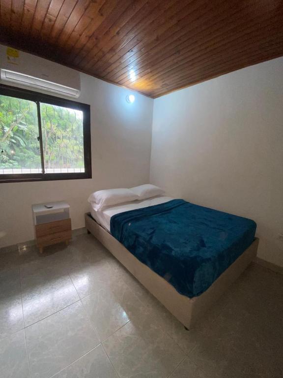 Postel nebo postele na pokoji v ubytování Hostal Aventura Tayrona