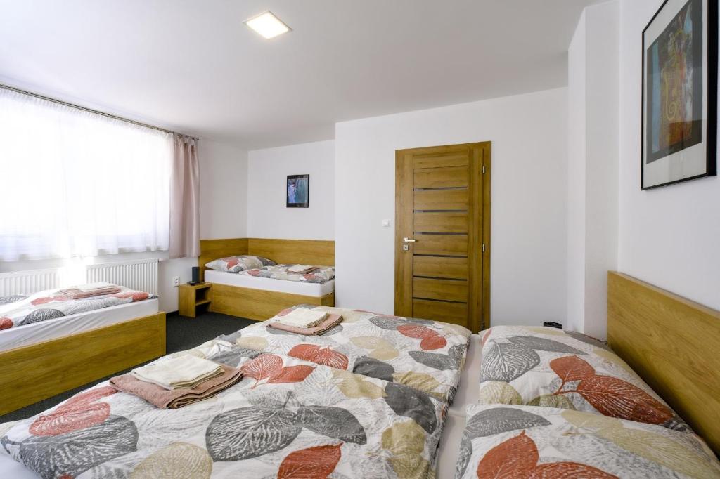 Postel nebo postele na pokoji v ubytování Villa Michaela