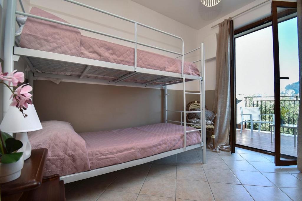 Postel nebo postele na pokoji v ubytování Casa Carini - Villa Vacanze sul Mare con piscina idromassaggio