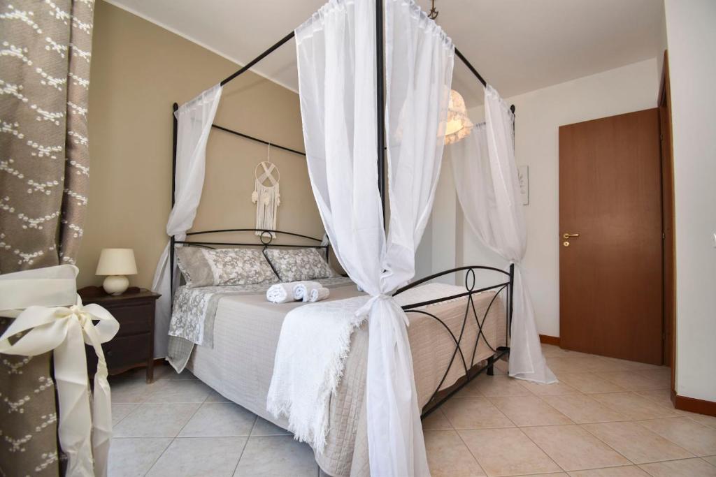 Postel nebo postele na pokoji v ubytování Casa Carini - Villa Vacanze sul Mare con piscina idromassaggio