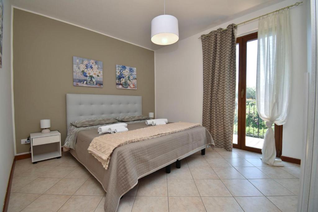Postel nebo postele na pokoji v ubytování Casa Carini - Villa Vacanze sul Mare con piscina idromassaggio