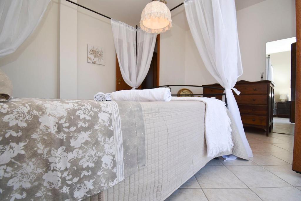 Postel nebo postele na pokoji v ubytování Casa Carini - Villa Vacanze sul Mare con piscina idromassaggio