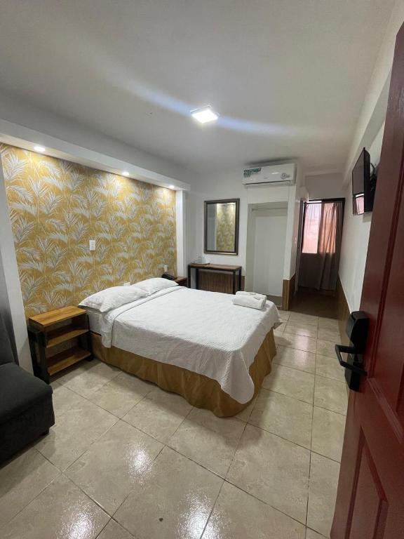 Postel nebo postele na pokoji v ubytování Hotel Costa Inn