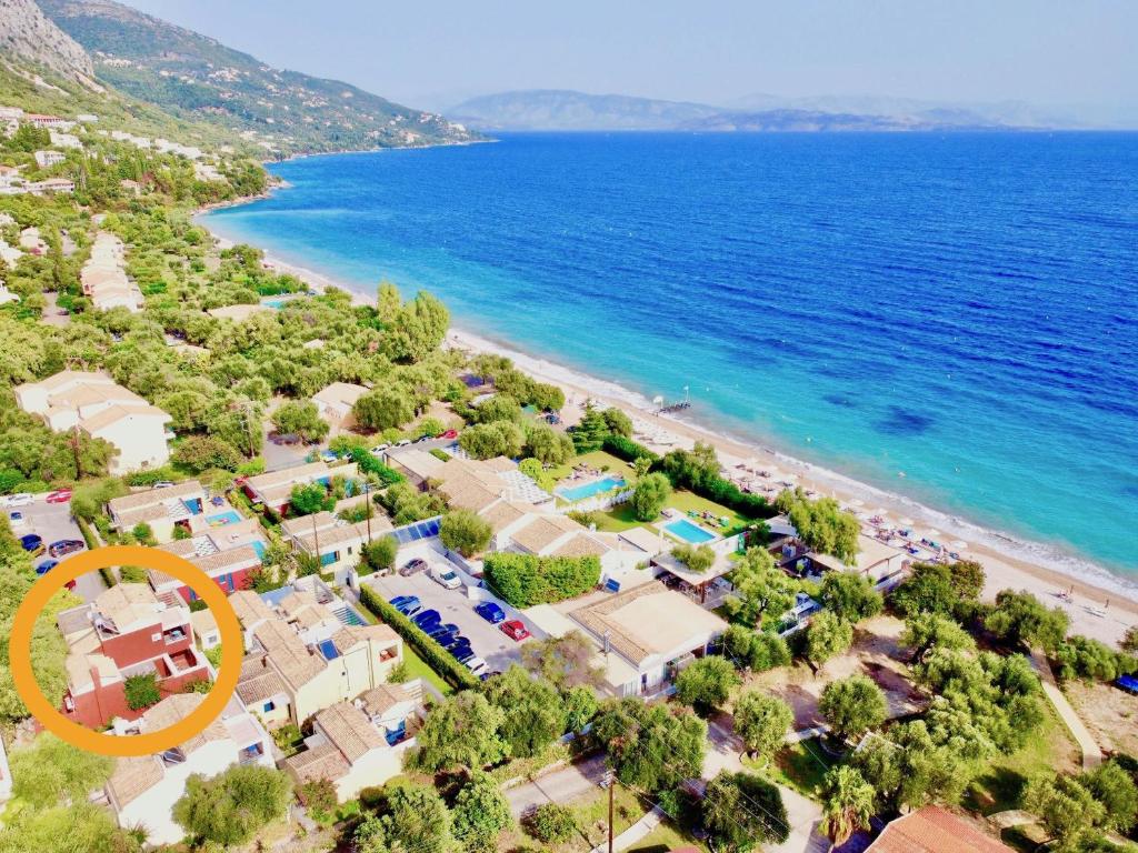 an aerial view of a beach with a large orange circle at Barbati Alpha MiniVilla by DadoVillas in Barbati