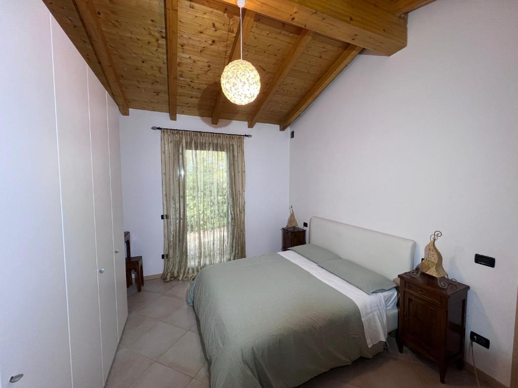 Postel nebo postele na pokoji v ubytování Al Vigneto
