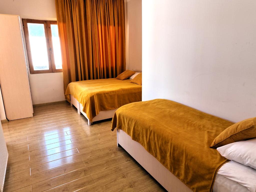 Postel nebo postele na pokoji v ubytování Guesthouse Lanchvali