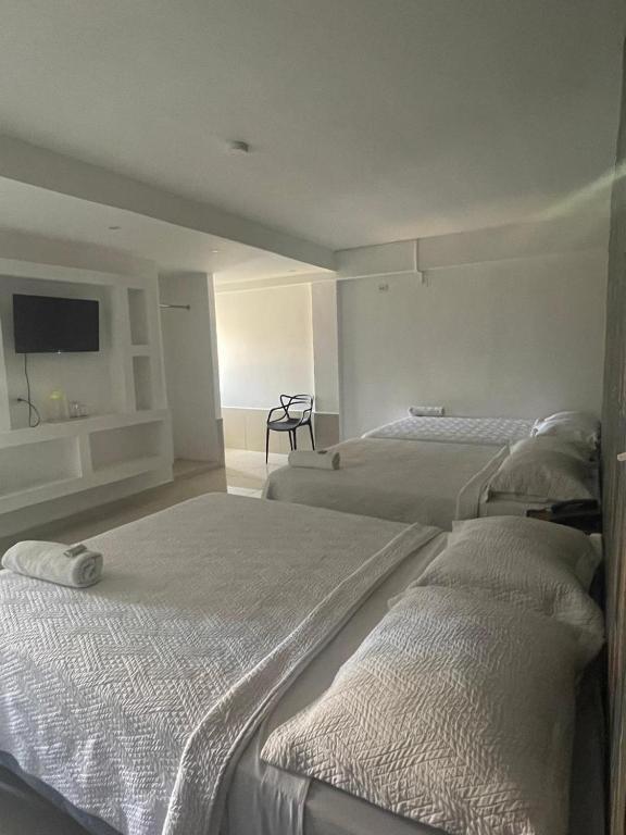 Postel nebo postele na pokoji v ubytování Hotel Costa Inn