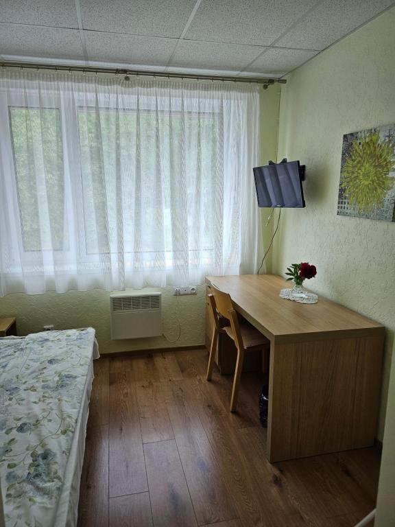 Postel nebo postele na pokoji v ubytování Vinni Hostel