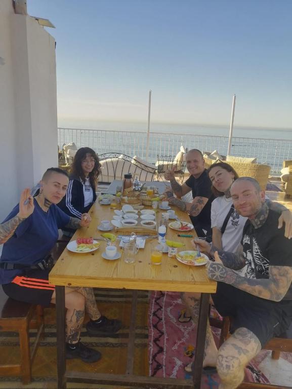 Dining area on the rooftop terrace overlooking the ocean.