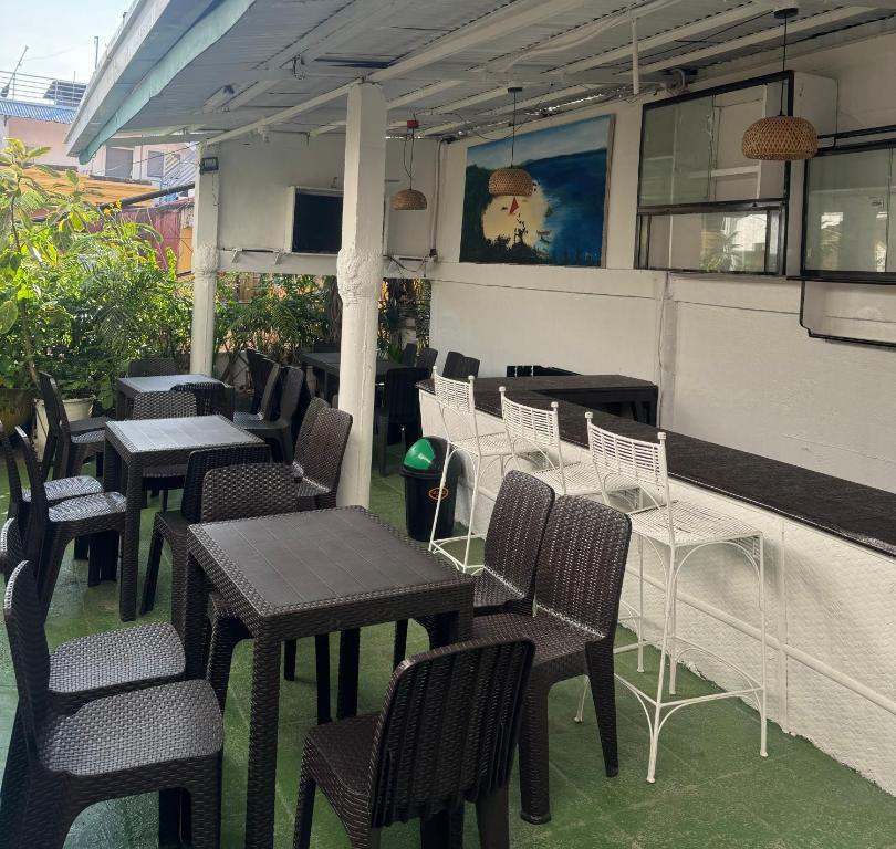 a group of tables and chairs on a patio at Hotel California in Boracay