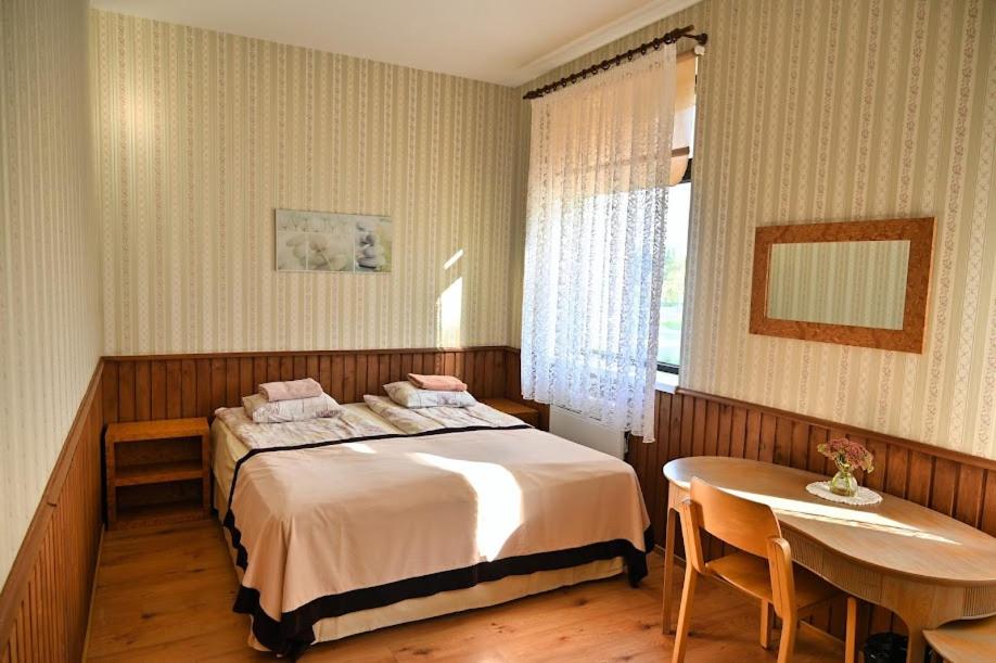 Postel nebo postele na pokoji v ubytování Vinni Hostel