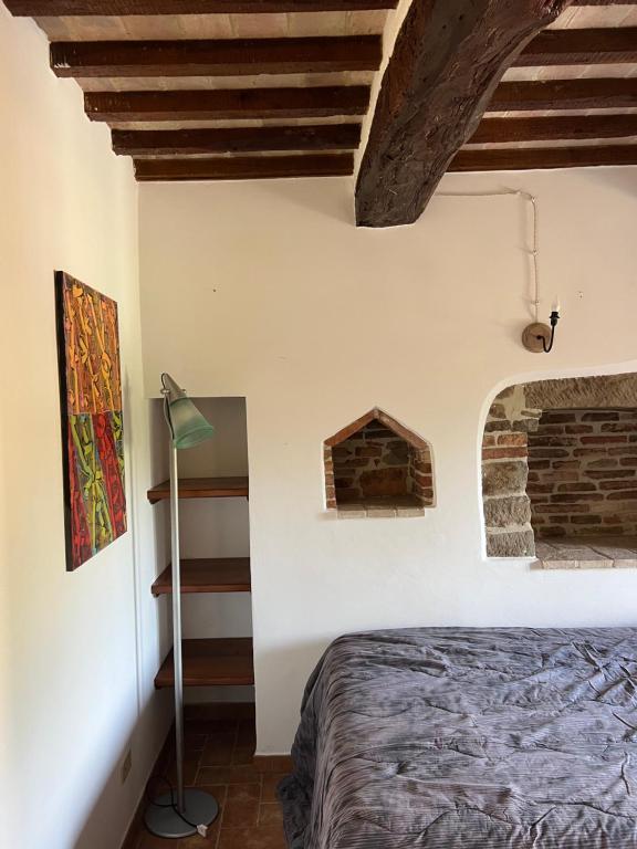 Postel nebo postele na pokoji v ubytování Assisi, da Lisetta