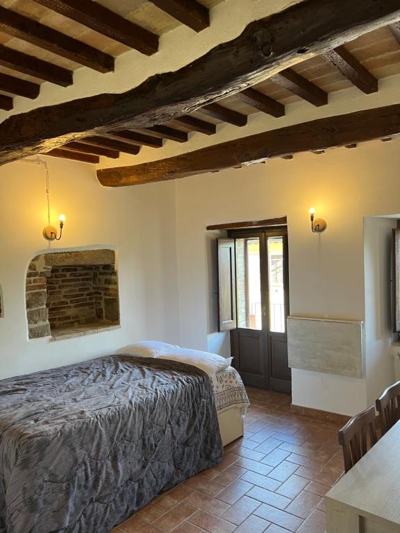 Postel nebo postele na pokoji v ubytování Assisi, da Lisetta
