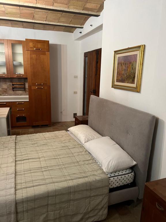 Postel nebo postele na pokoji v ubytování Assisi, da Lisetta
