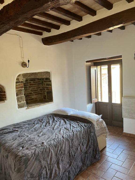 Postel nebo postele na pokoji v ubytování Assisi, da Lisetta