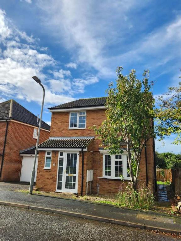 a brick house with a street light in front of it at 4 Bedroom home in Buckingham in Buckingham