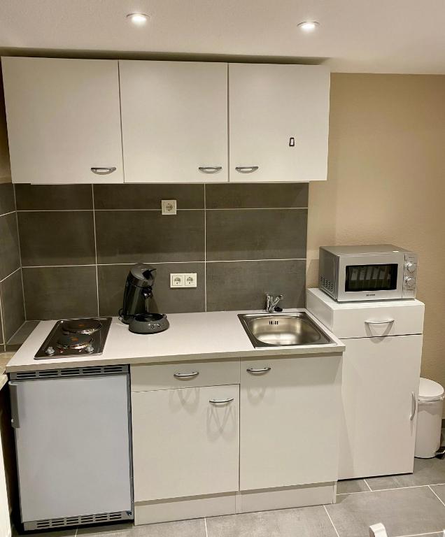 Kuchyň nebo kuchyňský kout v ubytování Haus Jonas