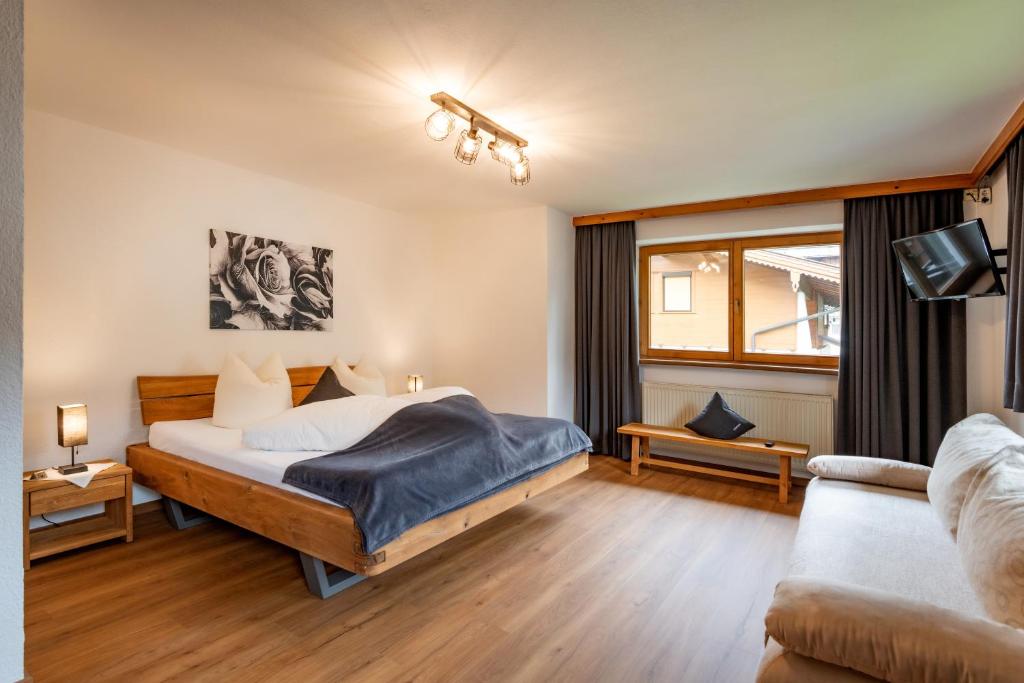 Postel nebo postele na pokoji v ubytování Haus Schroll