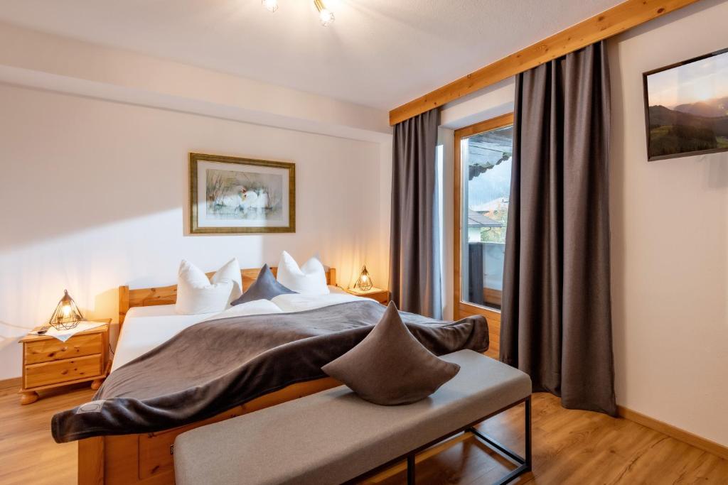 Postel nebo postele na pokoji v ubytování Haus Schroll