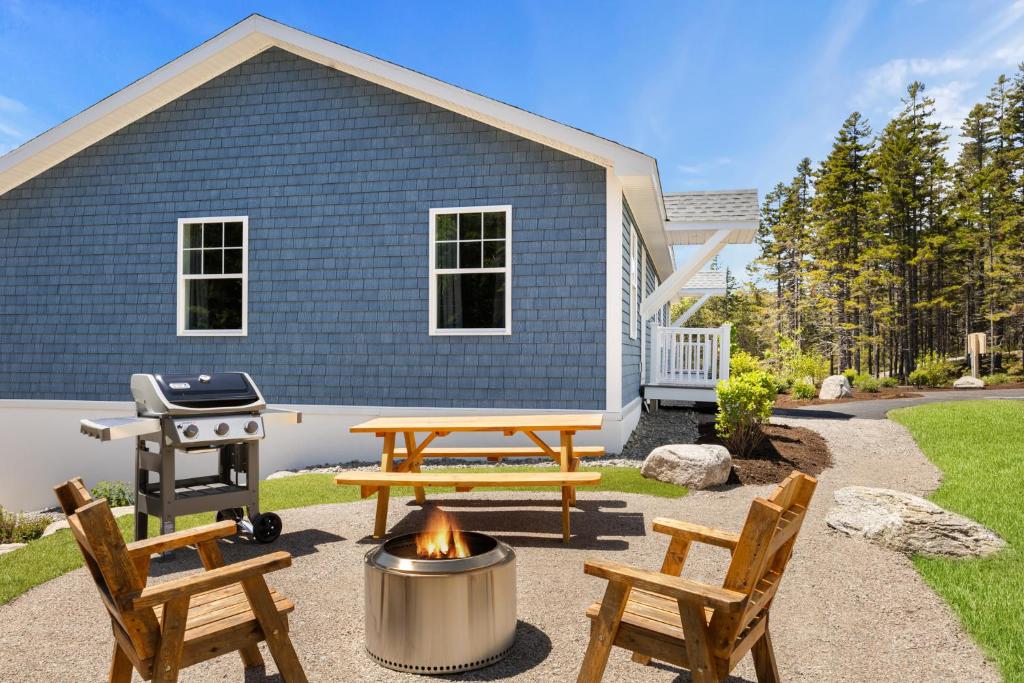 a backyard with a picnic table and a grill at 37b Orchard Hills Circle in Bernard