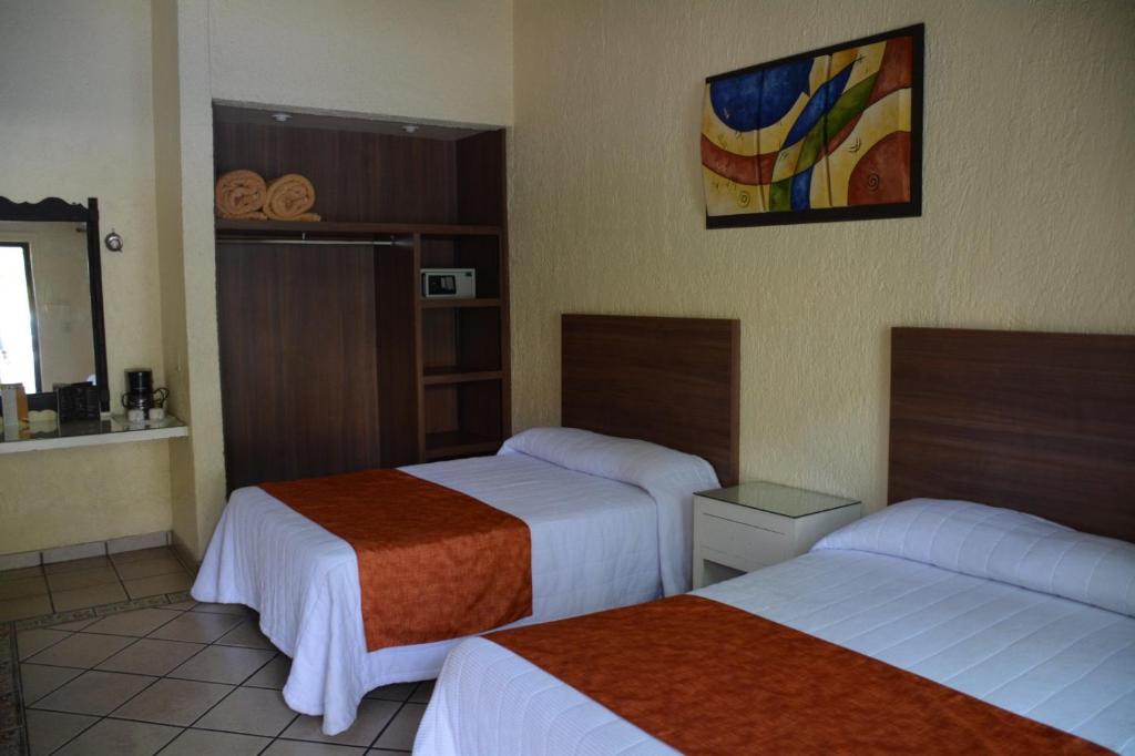 Postel nebo postele na pokoji v ubytování Hotel Posada Virreyes