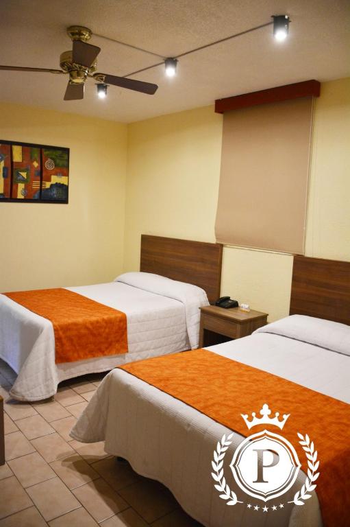 Postel nebo postele na pokoji v ubytování Hotel Posada Virreyes