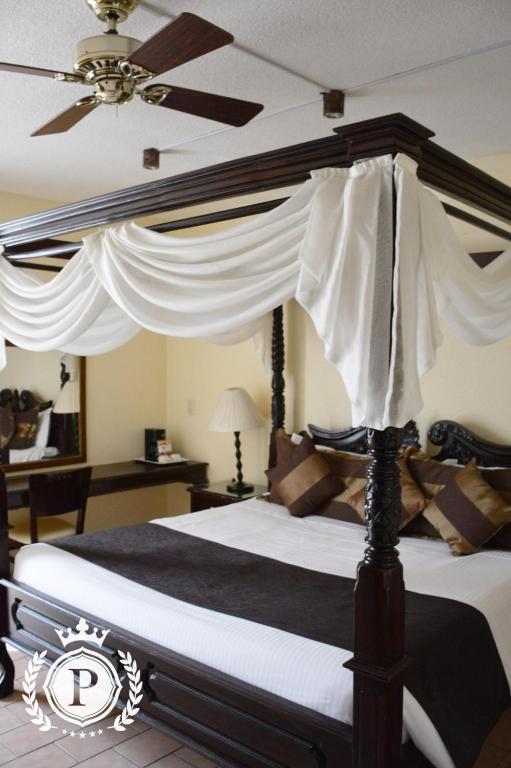 Postel nebo postele na pokoji v ubytování Hotel Posada Virreyes