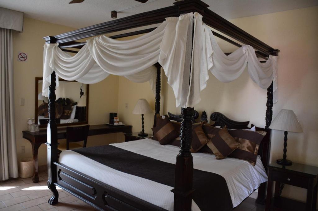 Postel nebo postele na pokoji v ubytování Hotel Posada Virreyes