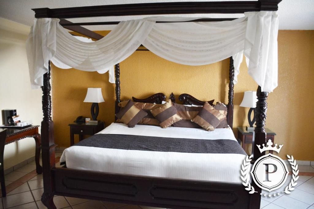 Postel nebo postele na pokoji v ubytování Hotel Posada Virreyes