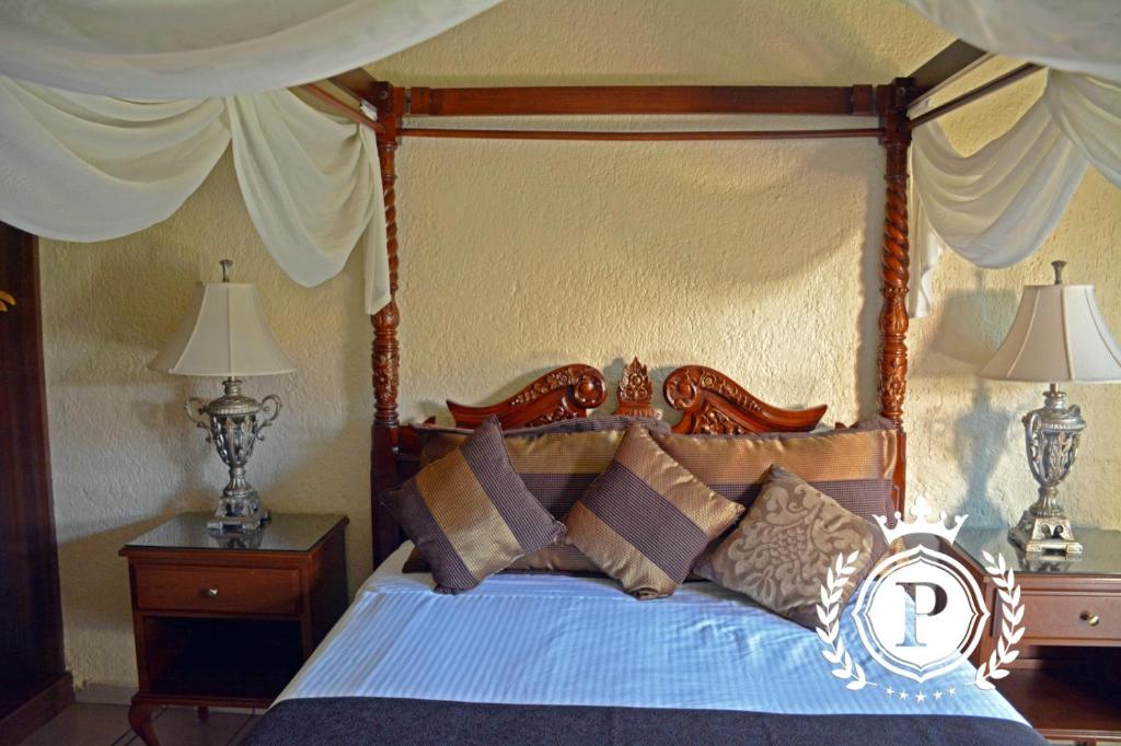 Postel nebo postele na pokoji v ubytování Hotel Posada Virreyes