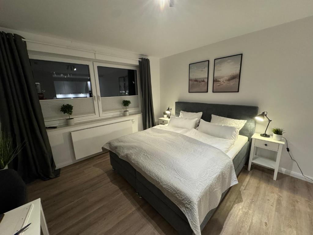 Ένα ή περισσότερα κρεβάτια σε δωμάτιο στο Apartment am Berliner Platz