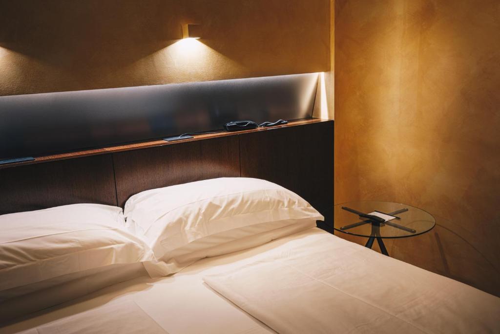 Postel nebo postele na pokoji v ubytování DelleArti Design Hotel