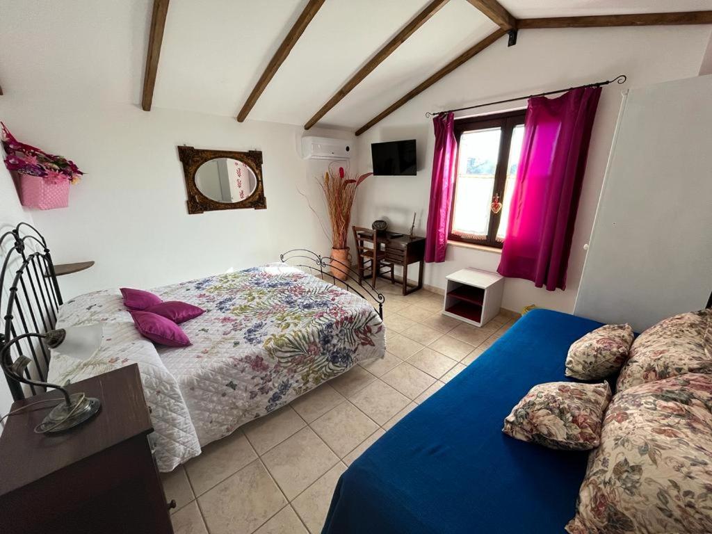 Postel nebo postele na pokoji v ubytování A Casa di Amici