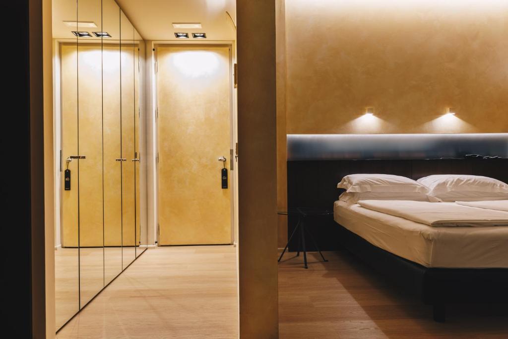Postel nebo postele na pokoji v ubytování DelleArti Design Hotel