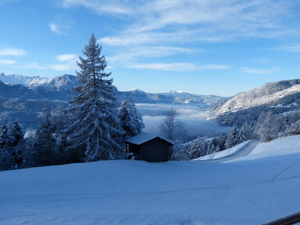 a cabin in the snow with a view of a valley at Haus Waldruhe in Villandro