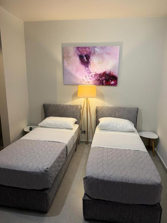 Postel nebo postele na pokoji v ubytování STAY-FIVE rooms & apartments