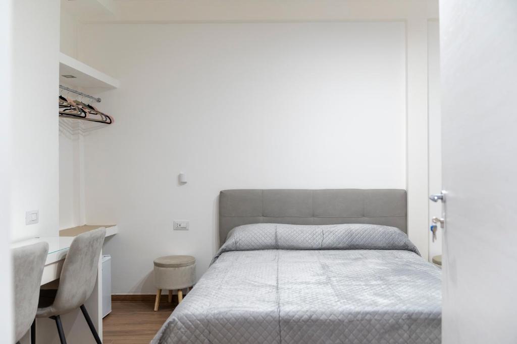 Postel nebo postele na pokoji v ubytování La Corte Guest House