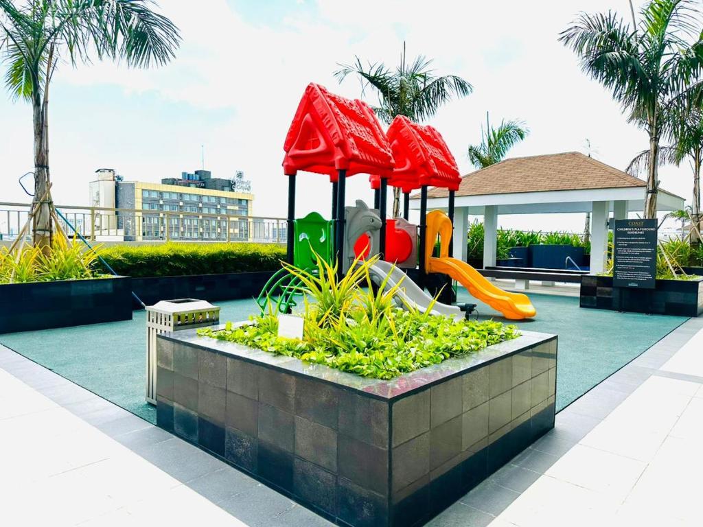 a playground on the roof of a building at Coast Residences - 1 Bedroom with Balcony near PICC, WTC, Star City & MOA in Manila