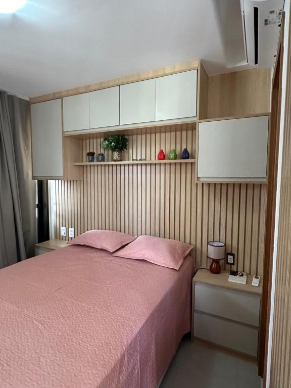 Ένα ή περισσότερα κρεβάτια σε δωμάτιο στο Barra- Salvador