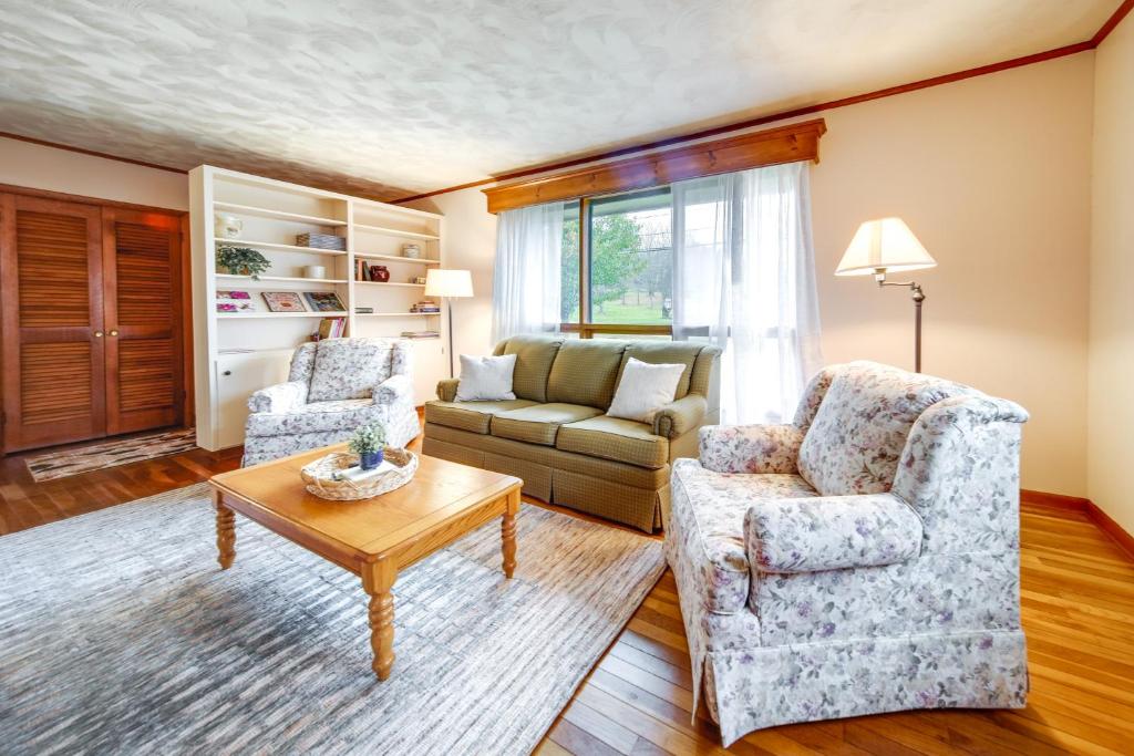 a living room with two chairs and a couch at Mayville Vacation Rental - Walk to Chautauqua Lake in Mayville