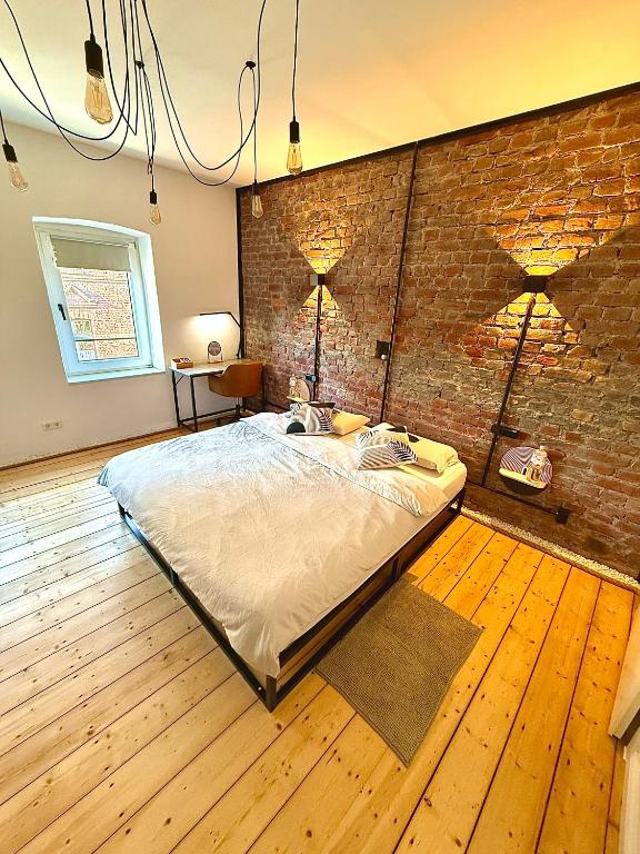 Postel nebo postele na pokoji v ubytování Suburban Loft