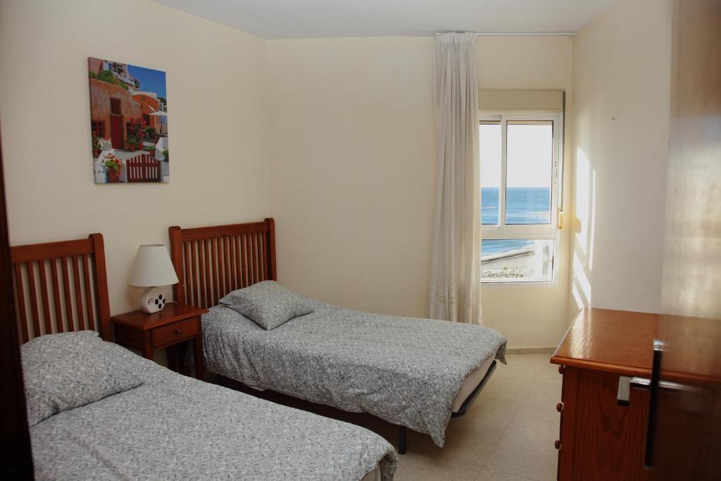 A bed or beds in a room at JSM Apartamentos