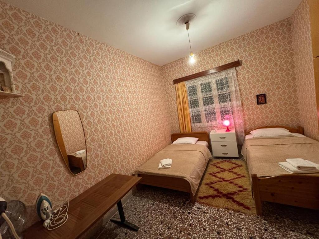 Postel nebo postele na pokoji v ubytování Το σπίτι της γιαγιάς