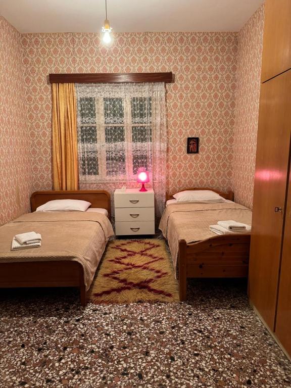 Postel nebo postele na pokoji v ubytování Το σπίτι της γιαγιάς