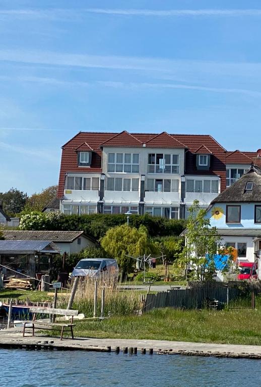 a large house on the shore of a body of water at Haus Sterngucker in Breege