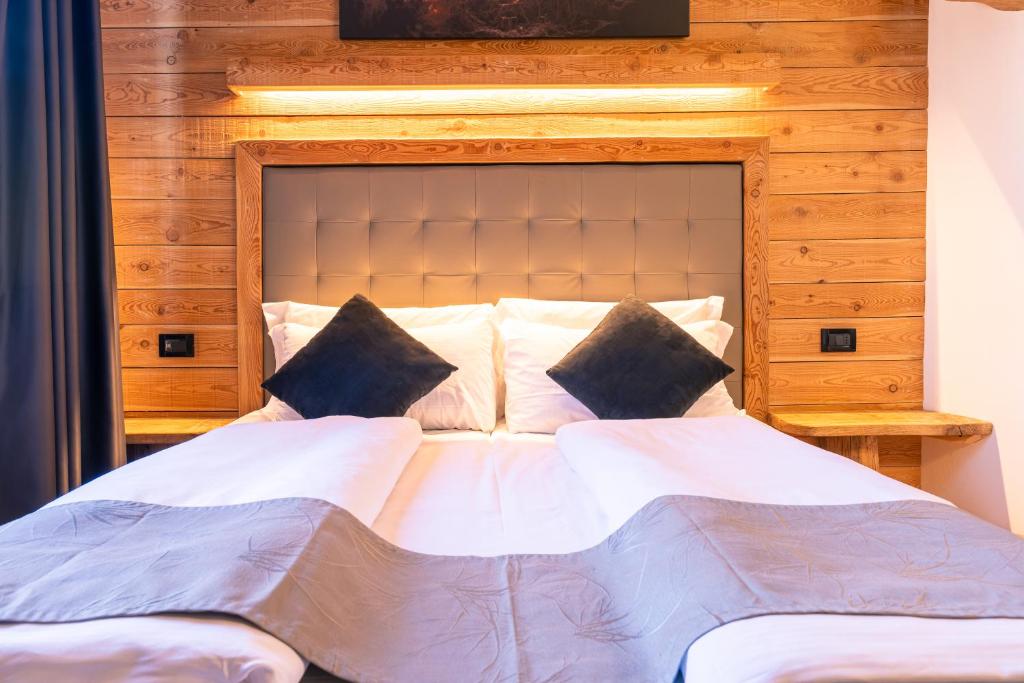 Postel nebo postele na pokoji v ubytování Hotel Irma
