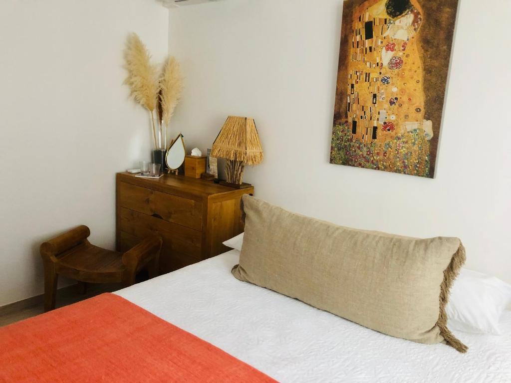 Postel nebo postele na pokoji v ubytování Chambre Manava